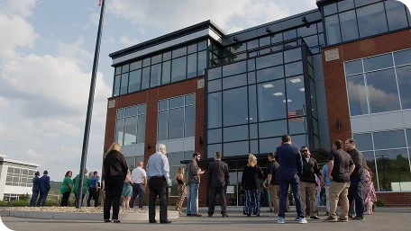 People walking into building